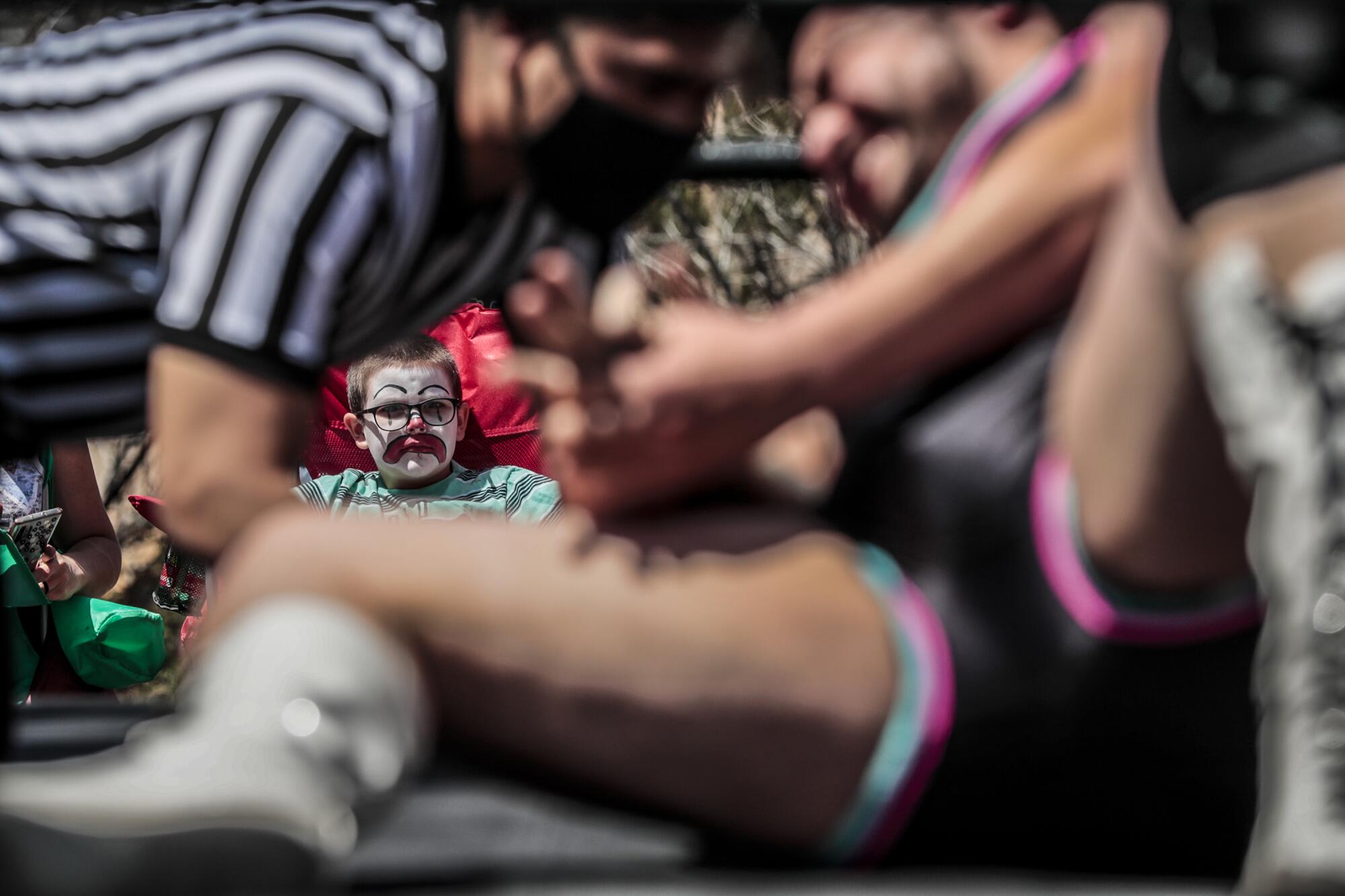 RJ Nascimento, 8, a Dirty Ron McDonald fan, sits ringside. 