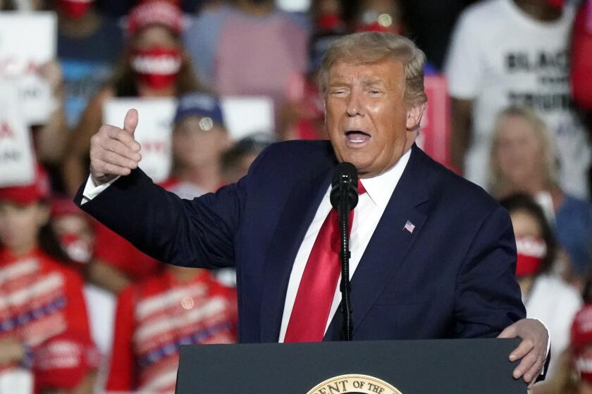 President Donald Trump speaks at campaign rally at the Orlando Sanford International Airport Monday, Oct. 12, 2020, in Sanford, Fla. (AP Photo/John Raoux)