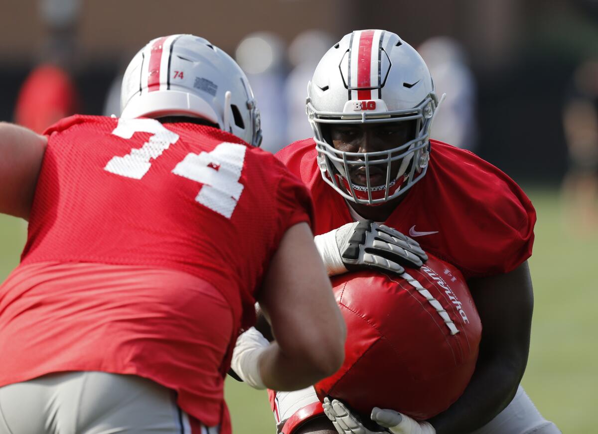 Ohio State offensive lineman Nicholas Petit-Frere runs a drill during practice.