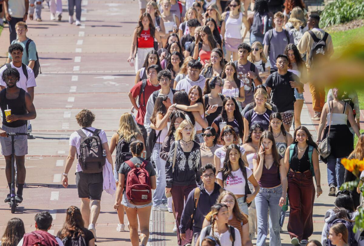Students walk to class at SDSU on their first day back to school on Tuesday, August 22, 2023 in the College area.