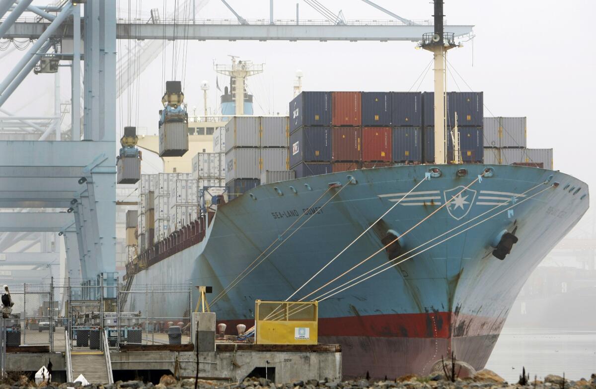 A report released by the National Retail Federation projects that December cargo volume will be up nearly 4% from December 2011. Above, a cargo ship is unloaded at the Port of Los Angeles after an eight-day strike ended.