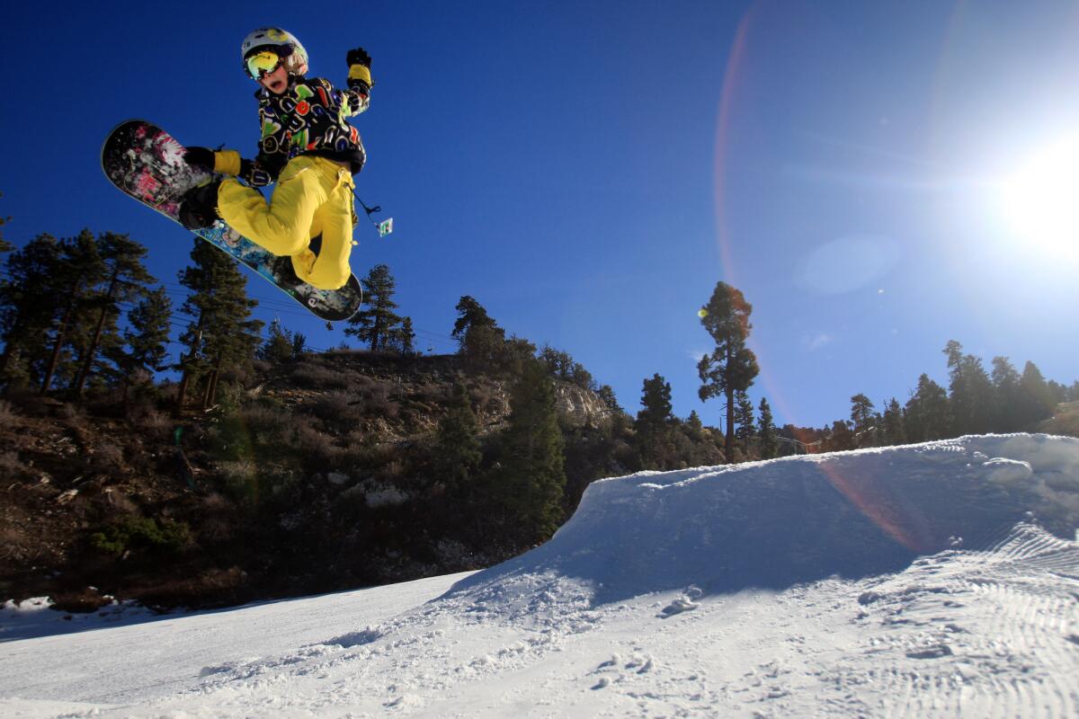 A snowboarder soars high off a jump at Bear Mountain, Big Bear Lake.