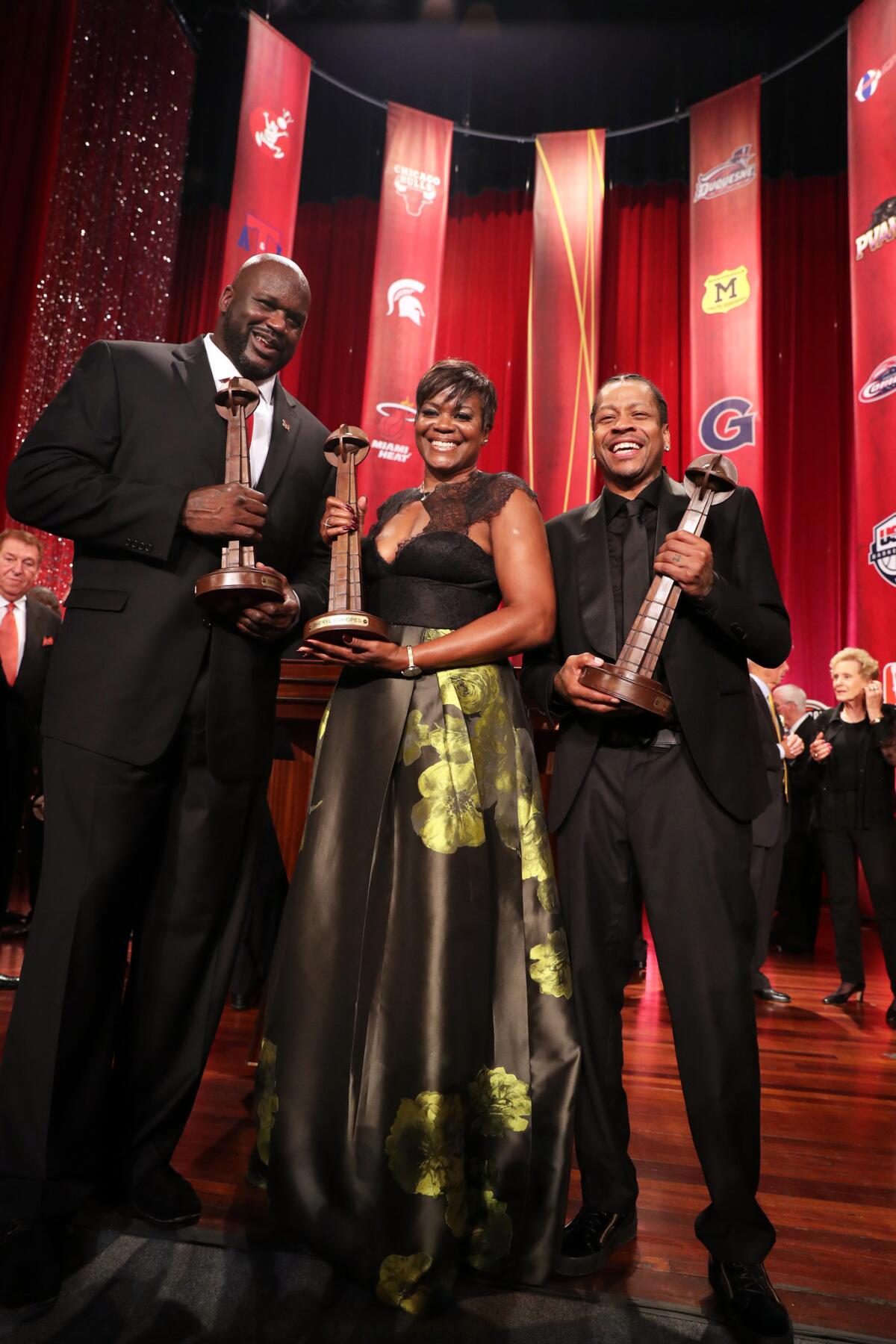 Basketball Hall of Fame inductees Shaquille O'Neal, left, Sheryl Swoopes and Allen Iverson appear onstage during the Basketball Hall of Fame Enshrinement Ceremony at Springfield Symphony Hall in Springfield, Mass., on Sept. 9, 2016.