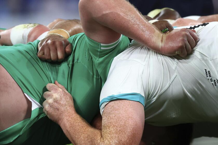 The Irish, left and South African scrum together during the Rugby World Cup Pool B match between South Africa and Ireland at the Stade de France in Saint-Denis, outside Paris, Saturday, Sept. 23, 2023. (AP Photo/Aurelien Morissard)