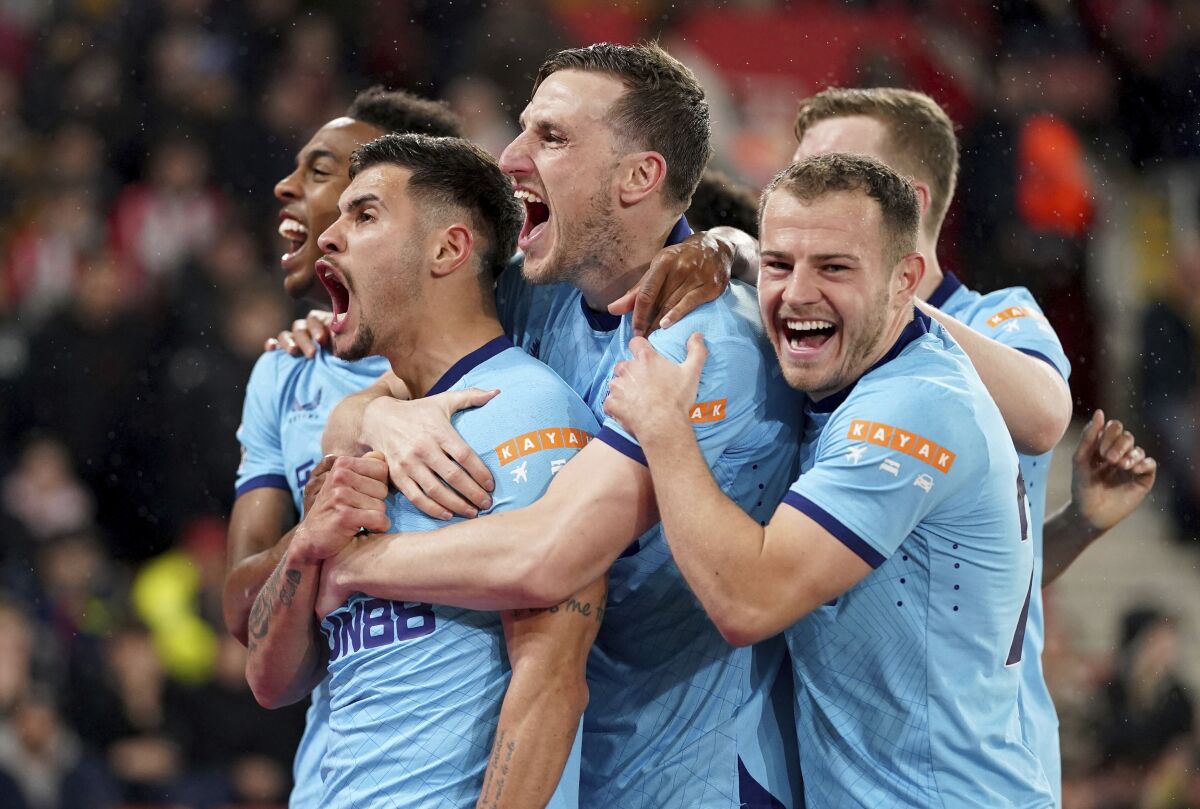 Newcastle United's Bruno Guimaraes, second left, celebrates scoring with teammates during the English Premier League soccer match between Southampton and Newcastle United at St Mary's Stadium, London, Thursday March 10, 2022. (Adam Davy/PA via AP)