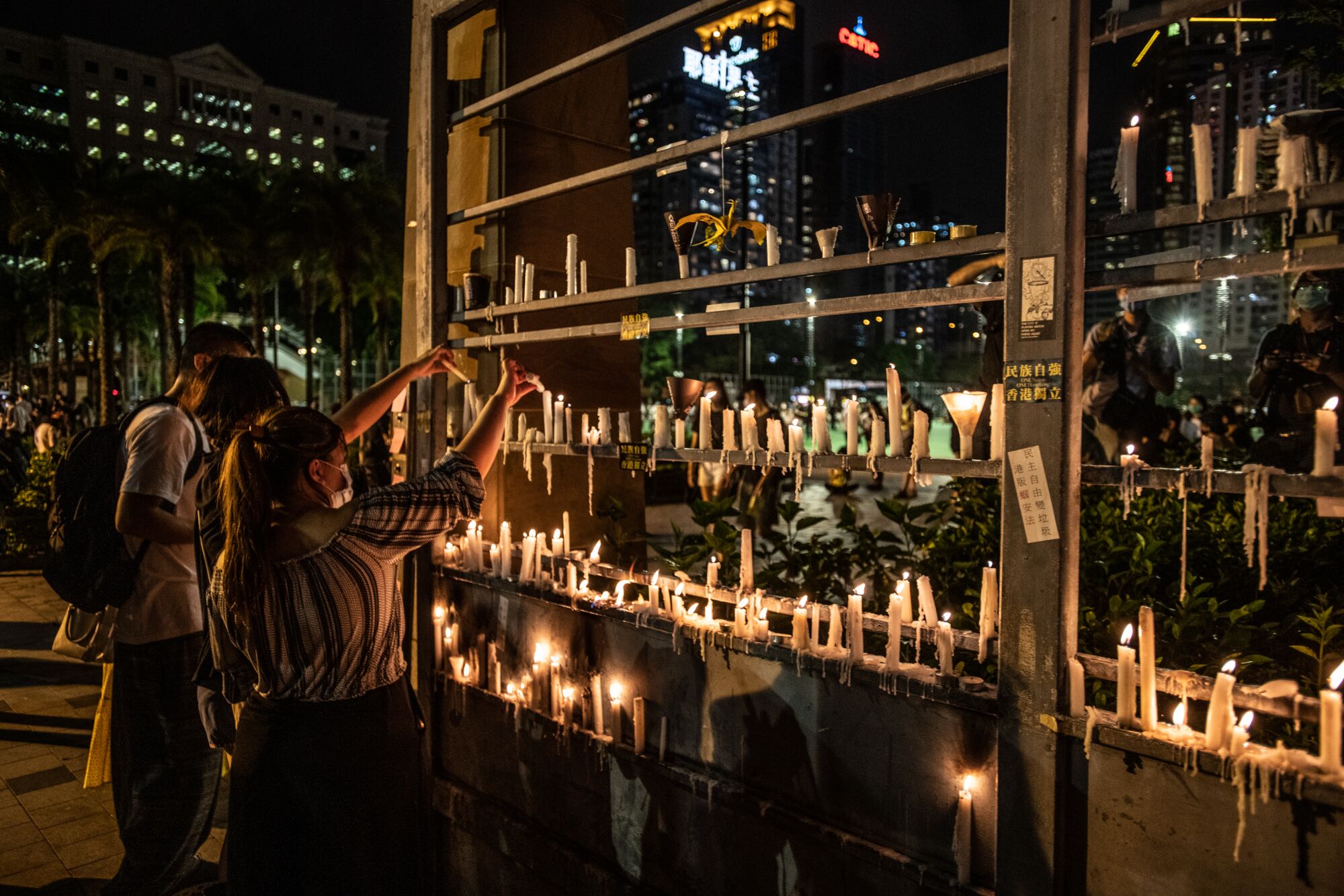 People light candles in Hong Kong in memory of slain Tiananmen Square protesters.
