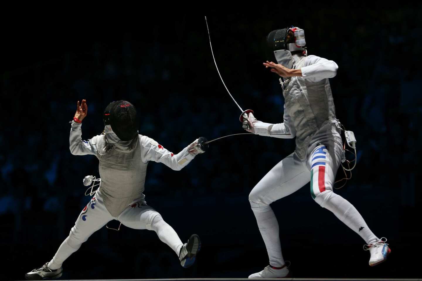 Valentina Vezzali of Italy, right, won the women's foil individual fencing bronze medal bout at ExCeL Centre.