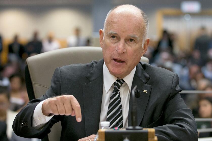 California Gov. Jerry Brown, left, responds to a question while testifying in support of Assembly Bill 398, by Assemblyman Eduardo Garcia, D-Coachella, one of two bills to extend state's cap and trade program, during a hearing of the Senate Environmental Quality committee, Thursday, July 13, 2017, in Sacramento, Calif. (AP Photo/Rich Pedroncelli)