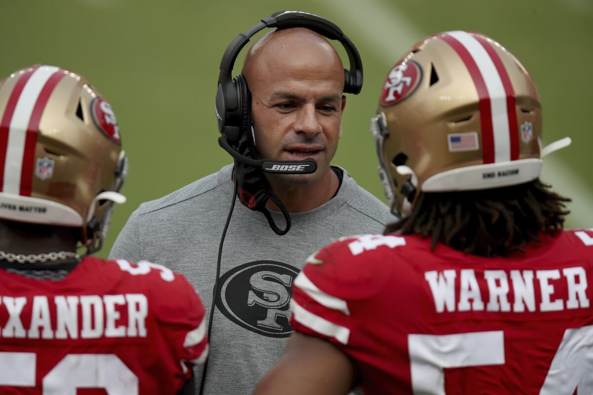 FILE - In this Sept. 13, 2020, file photo, San Francisco 49ers defensive coordinator Robert Saleh talks to players on the sideline during the team's NFL football game against the Arizona Cardinals in Santa Clara, Calif. Saleh inherited one of the worst defenses in the league when he arrived in 2017 and helped turn it into a dominant unit that helped the Niners reach the Super Bowl last season and remain in contention this season despite the string of injuries on both sides of the ball. (AP Photo/Scot Tucker, File)