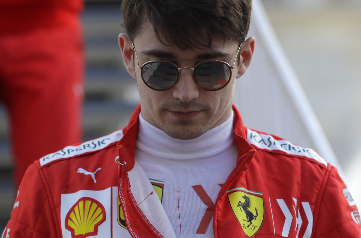 FILE - Ferrari driver Charles Leclerc of Monaco walks through the paddock prior to the qualifying session at the Baku Formula One city circuit in Baku, Azerbaijan, Saturday, April 27, 2019. Leclerc has signed a new multi-year contract with Ferrari on Thursday, Jan. 25, 2024. Ferrari has not revealed the length of Leclerc’s new contract but he says he will stay with the famous Scuderia for “several more seasons.” (AP Photo/Sergei Grits, File)