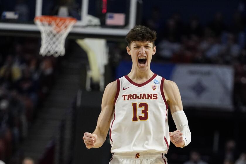 FILE - Southern California's Drew Peterson (13) reacts after missing a 3-point shot during the second half of a college basketball game against Miami in the first round of the NCAA tournament, Friday, March 18, 2022, in Greenville, S.C. The Trojans open the season at home on Nov. 7, 2022, against Florida Gulf Coast. (AP Photo/Brynn Anderson, File)