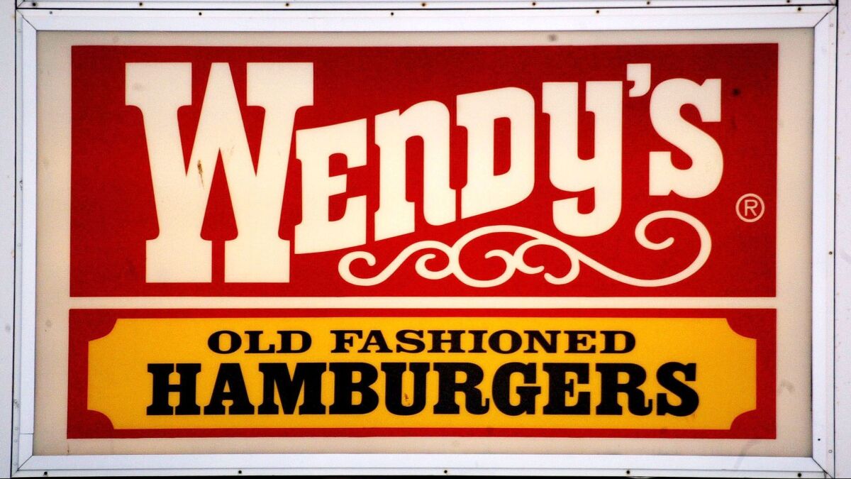 Wendy's, which touts its old-fashioned burgers, is rolling out self-service kiosks where customers can order food.