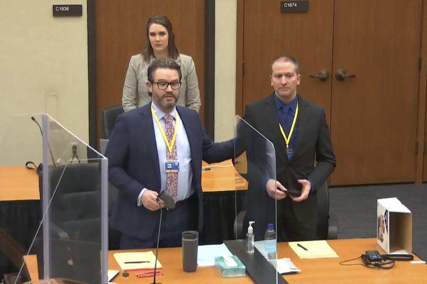 FILE - In this image taken from video, defense attorney Eric Nelson, left, defendant and former Minneapolis police officer Derek Chauvin, right, and Nelson's assistant Amy Voss, back, introduce themselves to potential jurors on Tuesday, March 23, 2021, as Hennepin County Judge Peter Cahill presides over jury selection in the trial of Chauvin at the Hennepin County Courthouse in Minneapolis. Chauvin is charged in the May 25, 2020 death of George Floyd. The huge task for jurors at the trial of Chauvin showed during jury selection as some would-be jurors said they were unnerved by the very thought of being on the panel. (Court TV, via AP, Pool)