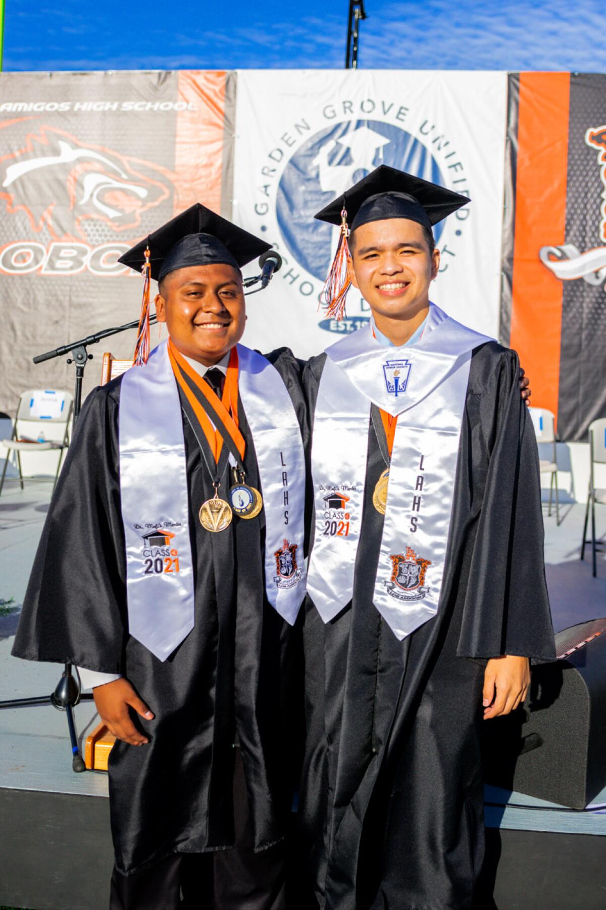 Los Amigos co-valedictorians Sebastian Lozano, left, and Kenny Tu Dao 