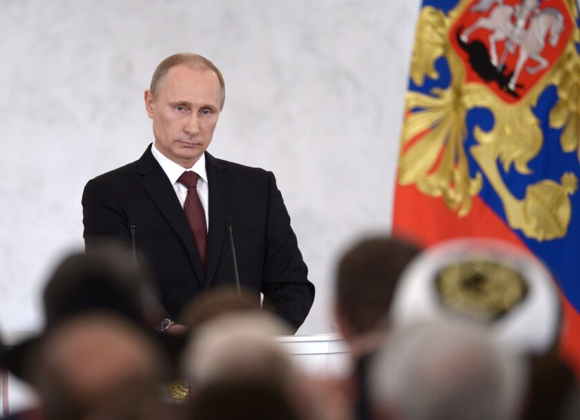 Russian President Vladimir Putin addresses a joint session of the country's parliament on the situation in Crimea.