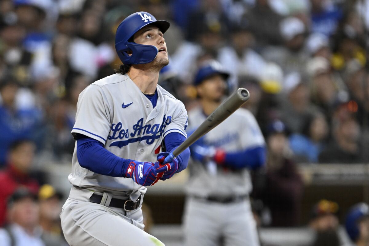 Dodgers' James Outman watches his two-run home run against the San Diego Padres during the 10th inning.