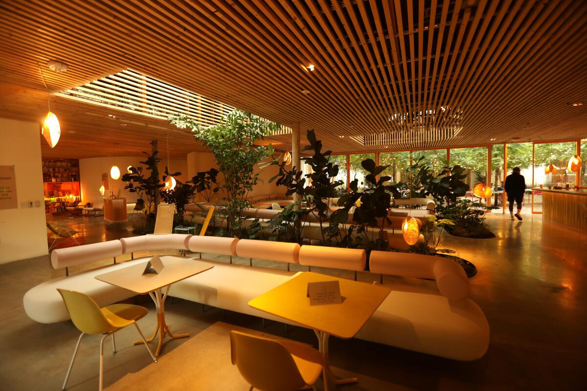 A man walks through the communal lounge at Second Home, a work share space in Hollywood on September 14, 2020.