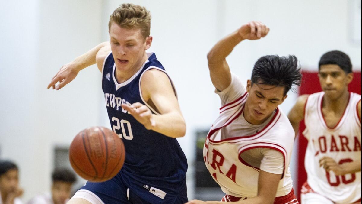 Newport Harbor High's Sam Barela, pictured on the left battling for a loose ball with Loara's David Lucio on Nov. 27, led the Sailors to a 60-50 win at Tesoro in the Orange County North-South Challenge on Saturday.