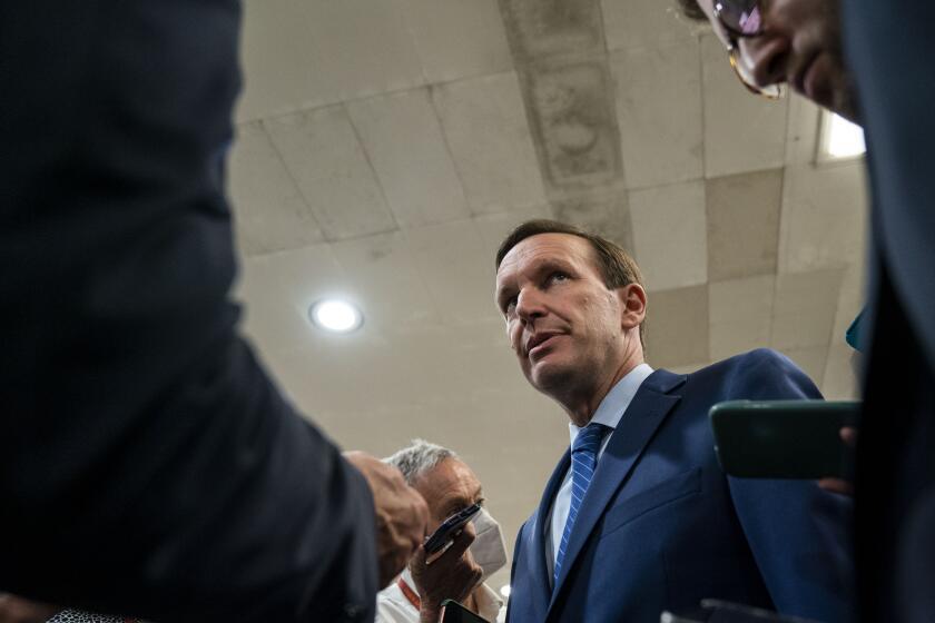 WASHINGTON, DC - JUNE 08: Sen. Chris Murphy (D-CT) speaks with reporters about ongoing negotiations regarding gun violence legislation in the Senate Subway on Capitol Hill on Wednesday, June 8, 2022 in Washington, DC. (Kent Nishimura / Los Angeles Times)