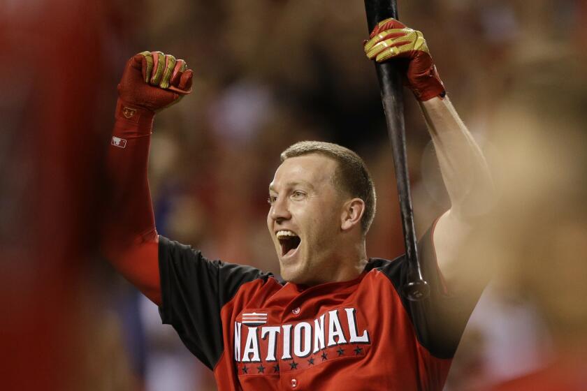National League All-Star Todd Frazier reacts after winning the home run derby. He beat Dodgers rookie Joc Pederson, 15-14, in the final round.