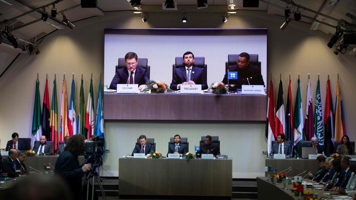 Russian Energy Minister Alexander Novak, from left, OPEC President Suhail Mazroueiand of the United Arab Emirates and OPEC Secretary-Gen. Mohammed Sanusi Barkindo of Nigeria lead a meeting Friday in Vienna.