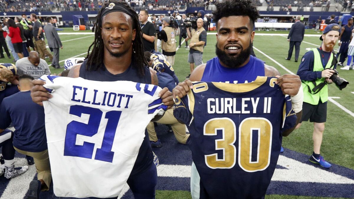 Rams' Todd Gurley, left, and Dallas Cowboys' Ezekiel Elliott swap jerseys after the game on Oct. 1, 2017 in Arlington, Texas. Gurley is a big football fan, and Elliott is one of his favorite players.