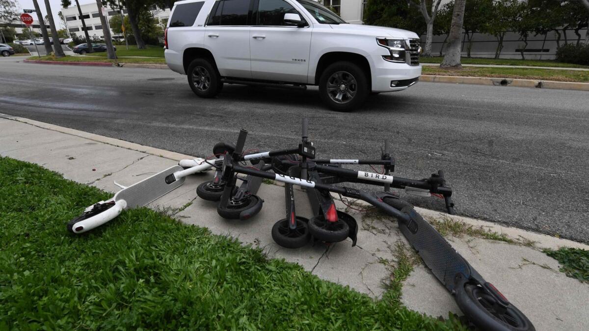 Shared electric scooters, which can be rented/unlocked via a smartphone app, were photographed in February piled on a Los Angeles sidewalk. A reader calls for them to either be banned entirely or have greater restrictions put on them within Burbank city limits.