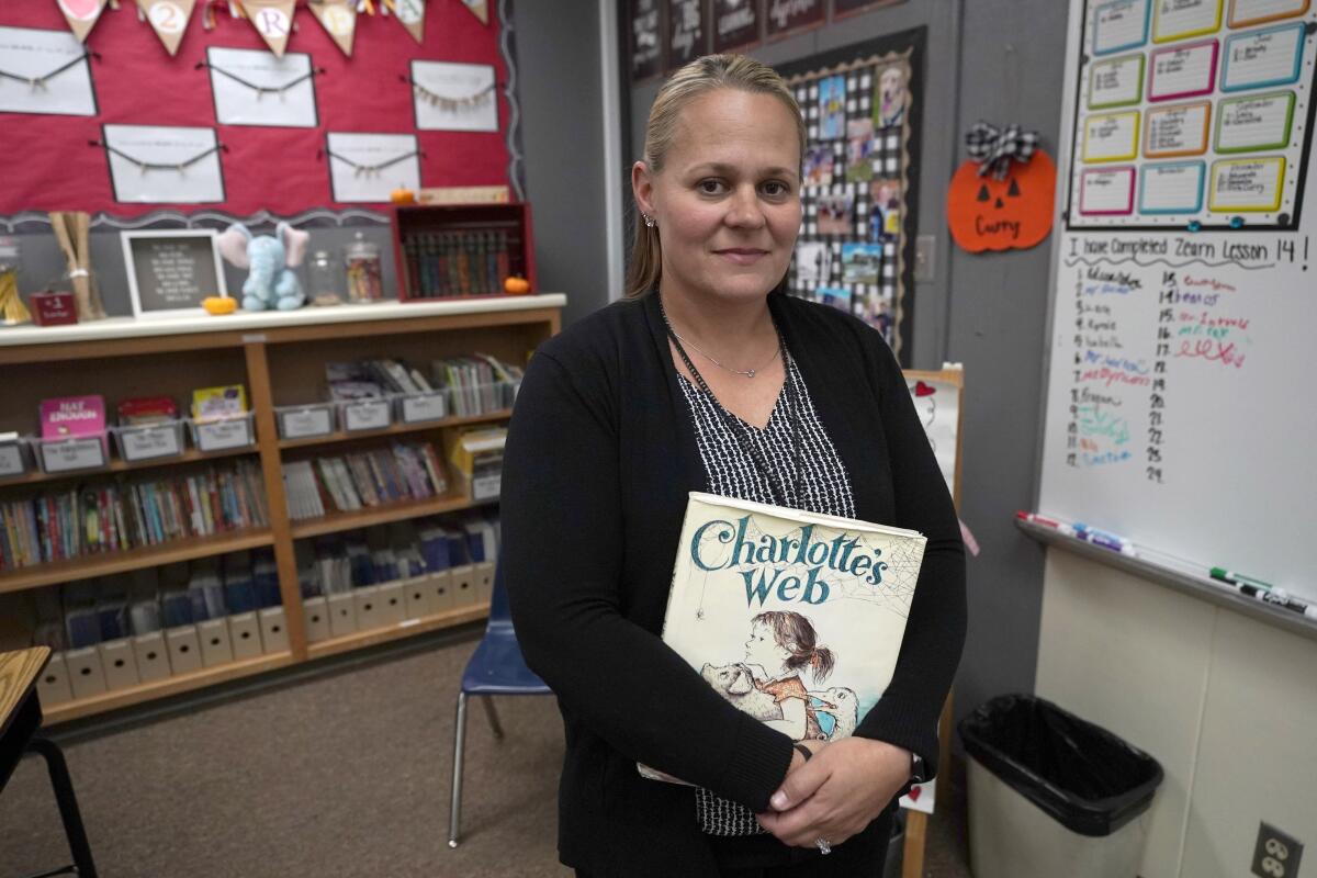 Teacher Sarah Curry stands for a portrait in her fourth grade classroom in rural Hickman, Calif.