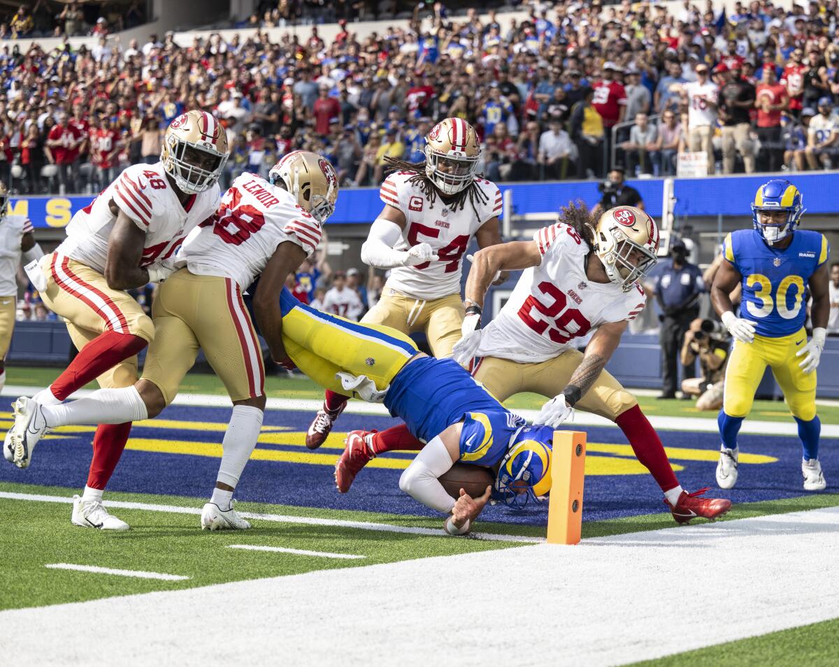 Rams quarterback Matthew Stafford dives for a touchdown against the San Francisco 49ers.