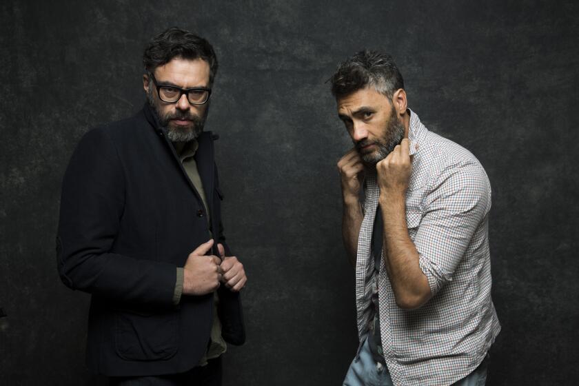 Actors and co-directors, Jemaine Clement' left, and Taika Waititi from the film "What We Do in The Shadows."