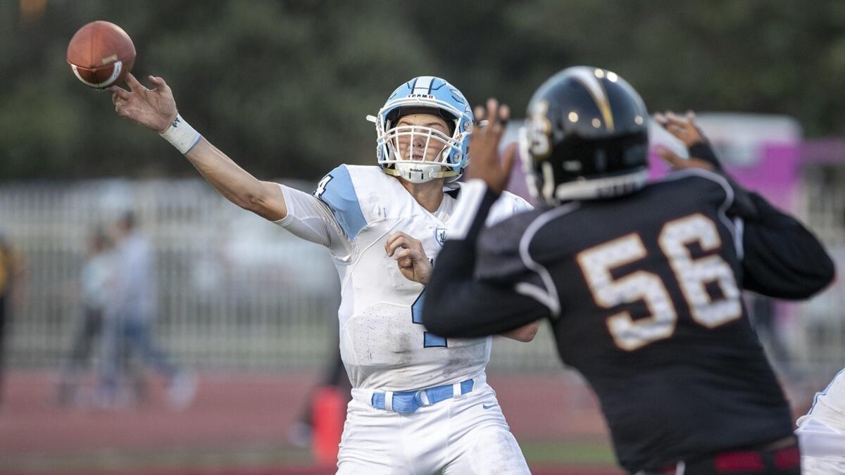 Corona del Mar's Ethan Garbers throws under pressure during a game against JSerra on Friday, August 17.