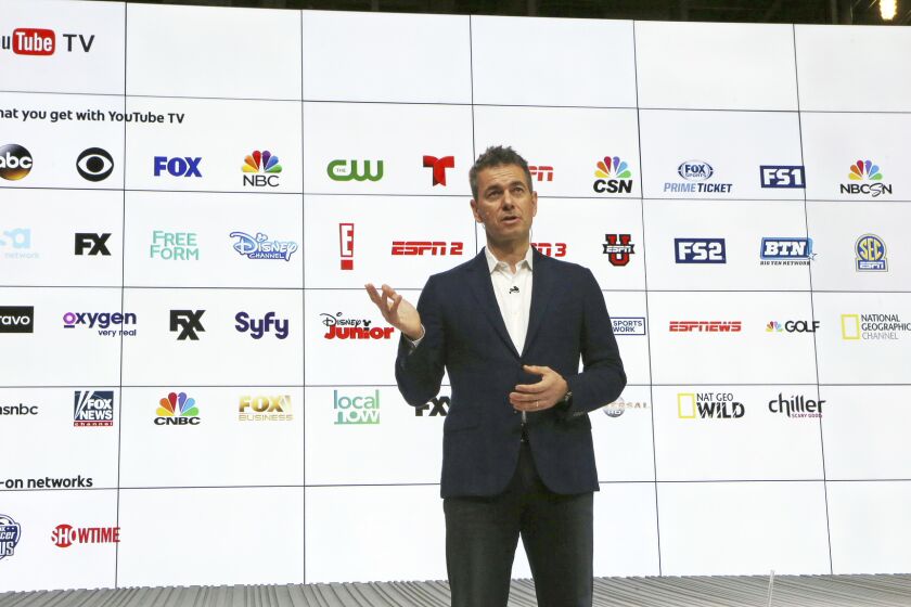 YouTube Chief Business Officer Robert Kuncl, with a graphic showing the many networks that will be carried, speaks during the introduction of YouTube TV in Playa Vista on Tuesday.