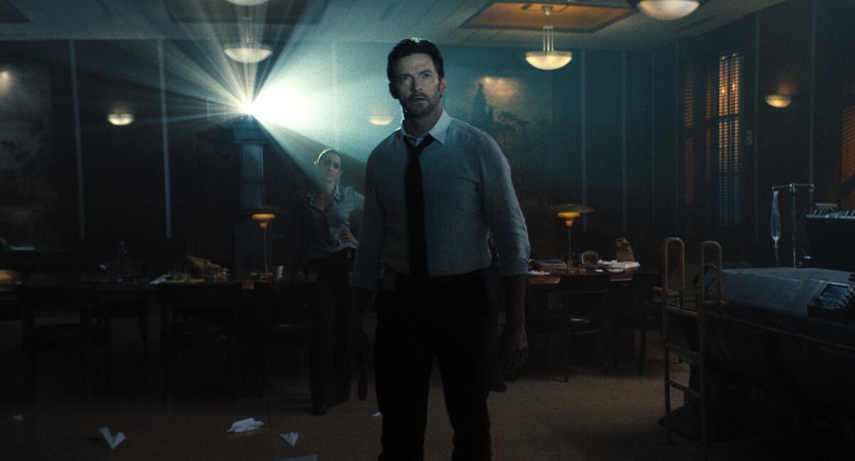 This image released by Warner Bros. Pictures shows Hugh Jackman in a scene from "Reminiscence." (Warner Bros. Pictures via AP)