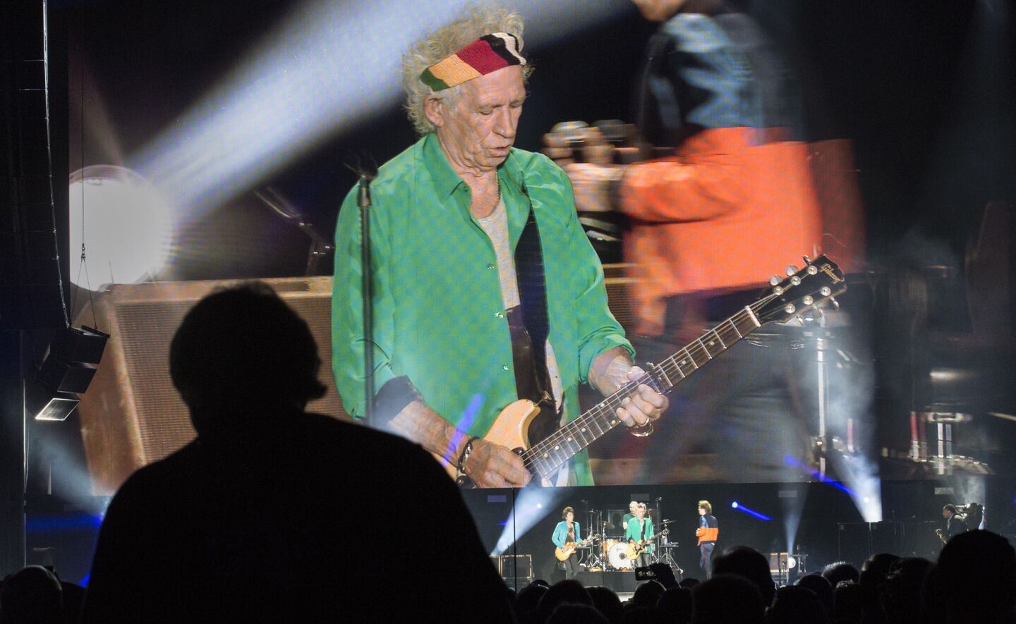 Guitarist Keith Richards appears on a jumbo video screen while performing with the Rolling Stones on the first day of Desert Trip in Indio.