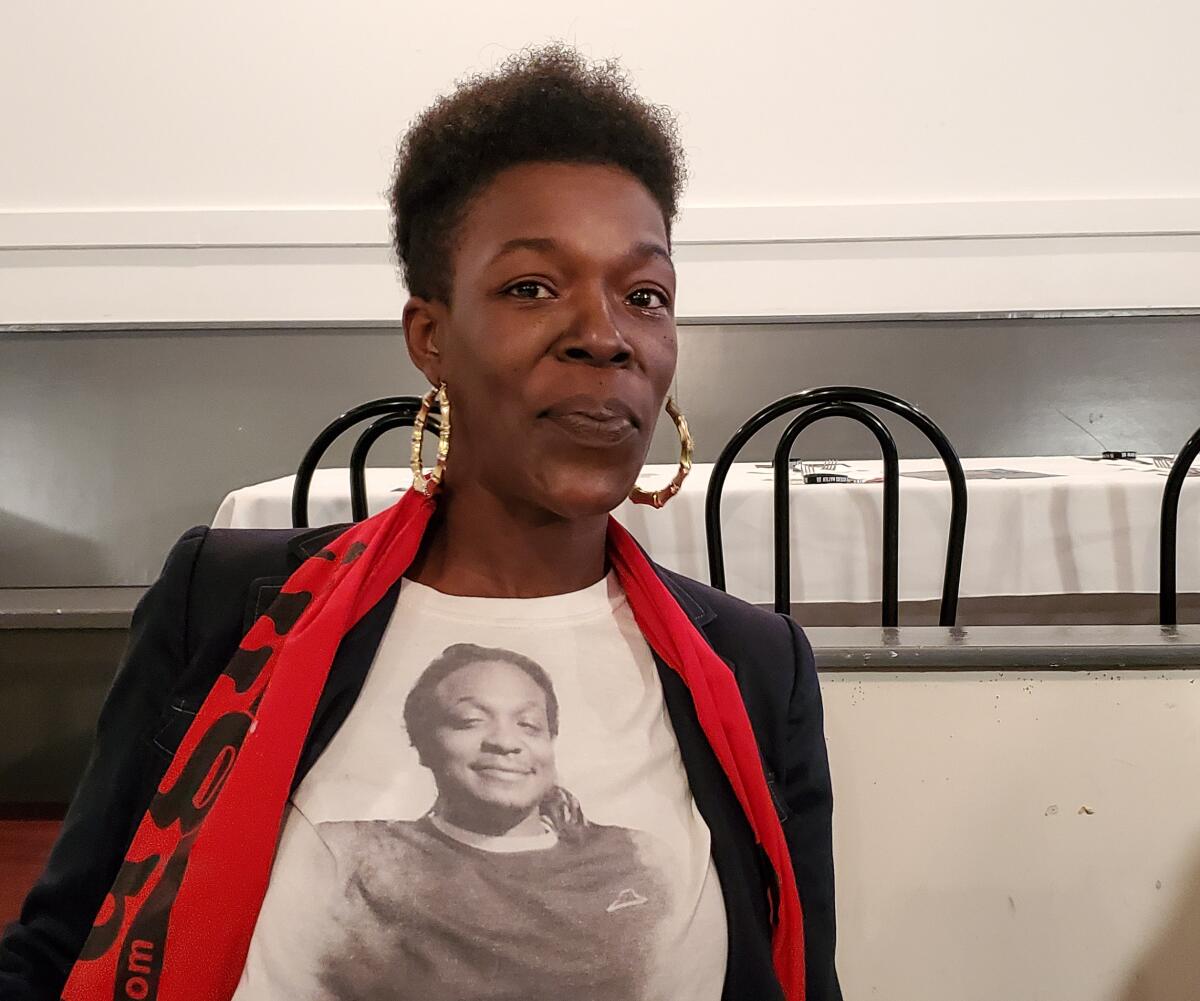 Erica Cokley of Charleston, 39, is a mother of three who attended a debate watch party in the city of North Charleston. She wore a t-shirt in honor of her late brother, Luther Jermaine Mitchell, who was killed in a shooting five years ago.