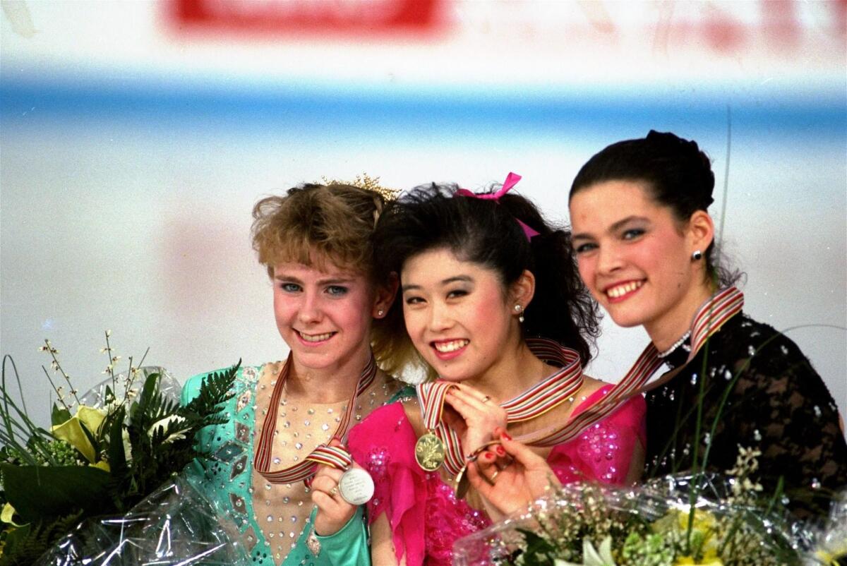 Tonya Harding, left, Kristi Yamaguchi and Nancy Kerrigan after the finals of the 1991 World Figure Skating Championships.
