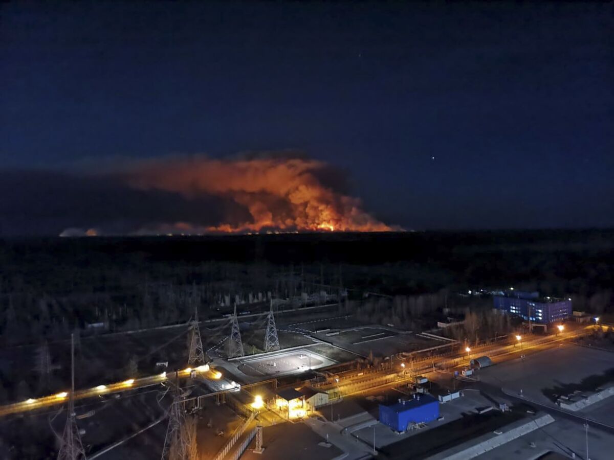 A forest fire burns April 10 inside the exclusion zone around the Chernobyl nuclear power station in Ukraine.