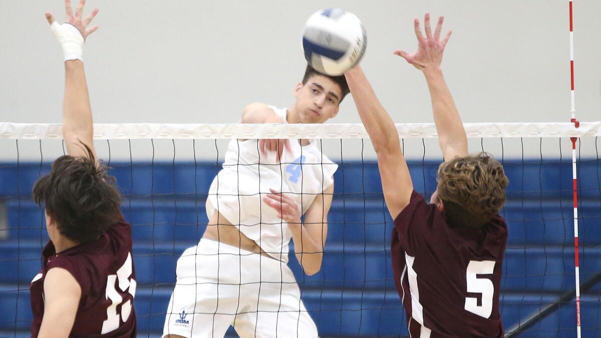 Kevin Kobrine (4), shown hammering a kill during a match on March 13, earned tournament MVP honors as Corona del Mar High boys' volleyball won the Santa Barbara Tournament of Champions on Saturday.