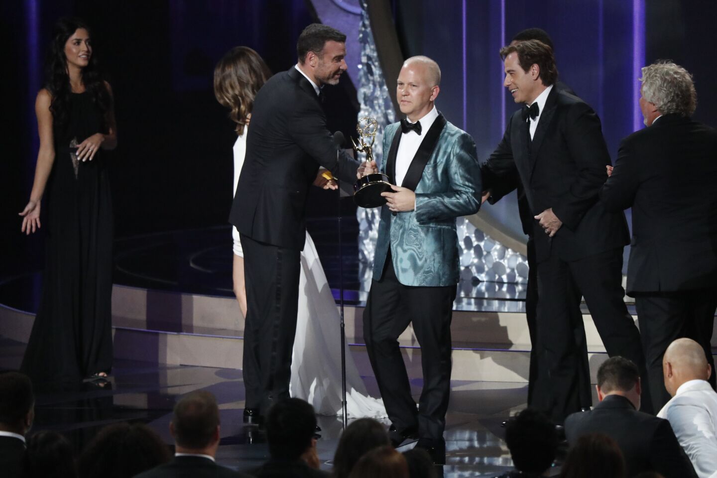 Ryan Murphy, left, and John Travolta accept the award for limited series for "The People v. O.J. Simpson: American Crime Story.