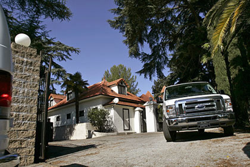 Vans carry jurors in the second murder trial of Phil Spector to the legendary music producer's mansion in Alhambra.