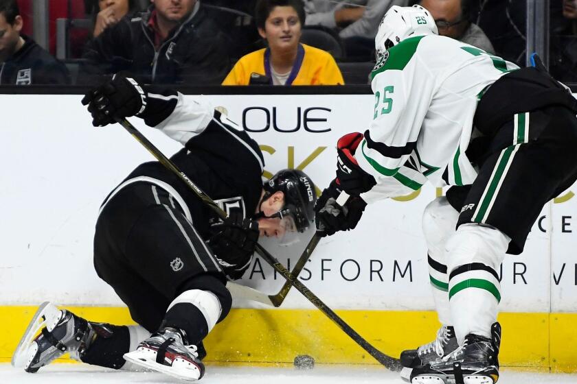 The Kings' Tanner Pearson, left, and the Dallas Stars' Brett Ritchie battle for the puck Jan. 9.