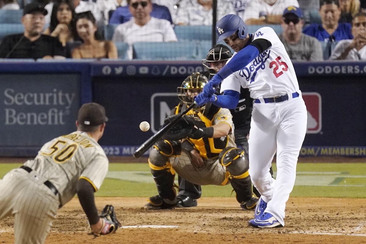 Dodgers left fielder Trayce Thompson hits a three-run home run off San Diego Padres relief pitcher Adrian Morejon.