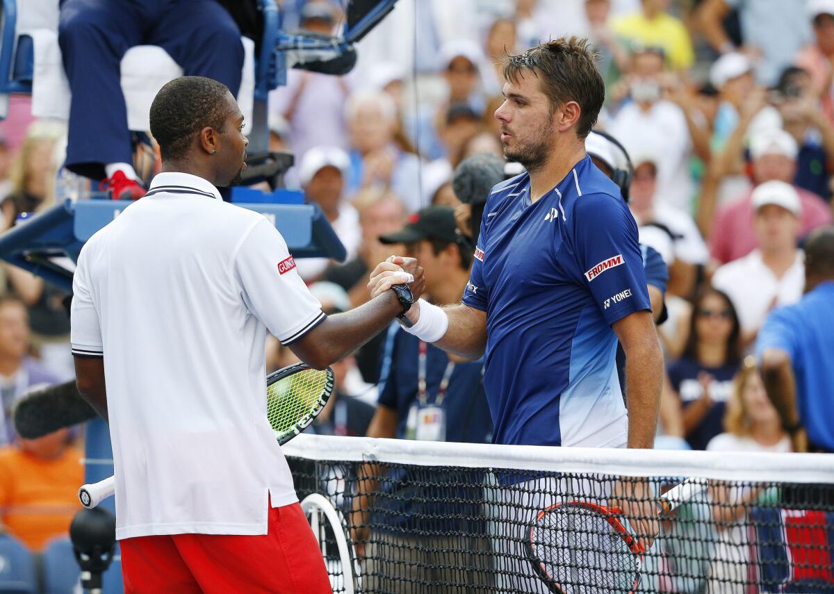 Donald Young, left, and Stan Wawrinka meet at the net after their 2015 US Open match.