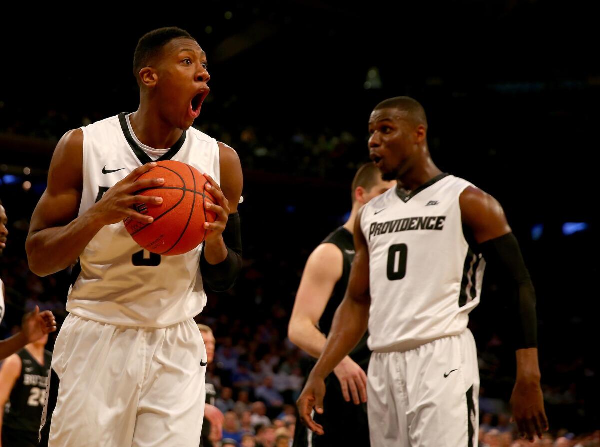Providence guard Kris Dunn (3) and forward Ben Bentil (0) react after Dunn strips the ball from a Butler player during the Big East tournament.
