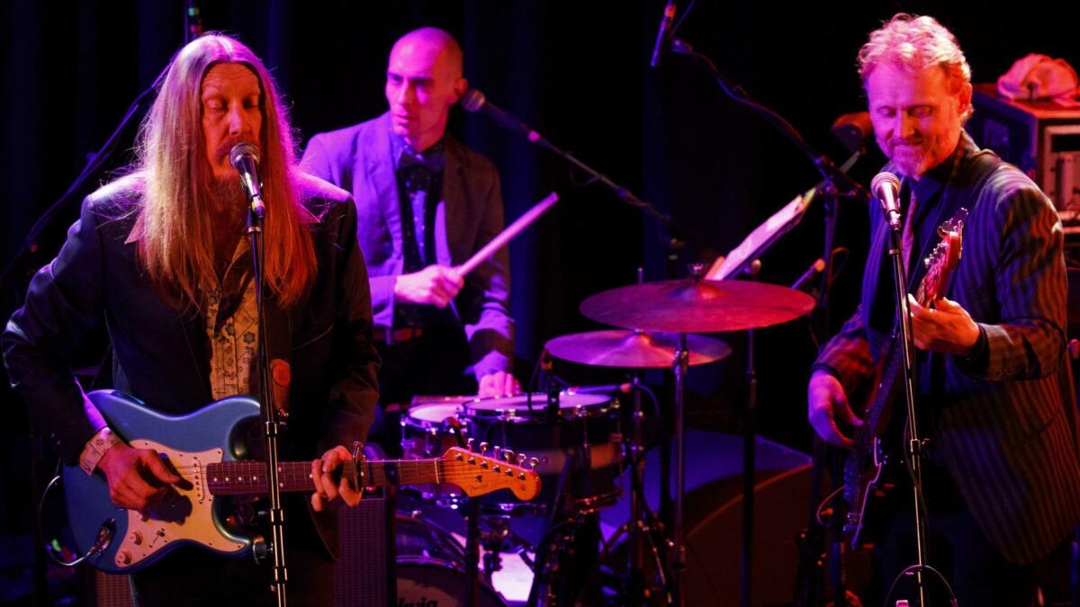 Grammy Award-nominated sibling trio The Wood Brothers--Chris Wood, left, Oliver Wood, and Jano Rix--were among more than two dozen acts that saluted John Prine on Saturday at The Troubadour.