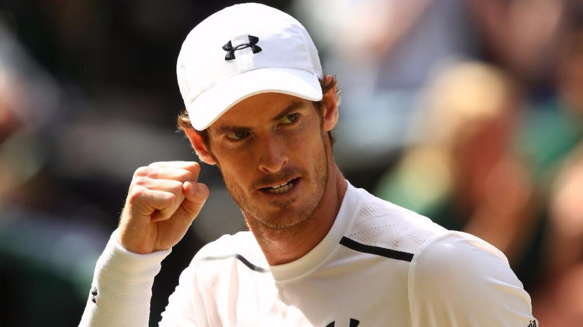 Andy Murray of Great Britain reacts during his match against Milos Raonic of Canada in the men's final of the Wimbledon Championships on Sunday.