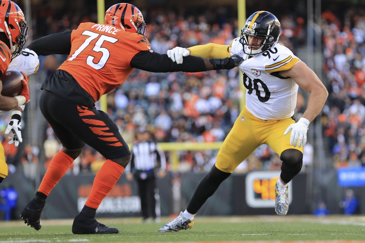 Pittsburgh Steelers outside linebacker T.J. Watt (90) battles Cincinnati Bengals offensive tackle Isaiah Prince (75) as he tries to rush the passer during the second half of an NFL football game, Sunday, Nov. 28, 2021, in Cincinnati. (AP Photo/Aaron Doster)