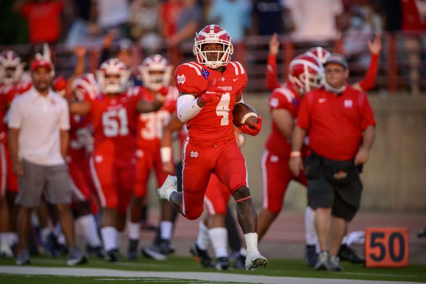 Duncanville, TX - August 27: Mater Dei Monarchs running back Raleek Brown (4) runs for a touchdown against the Duncanville Panthers during the game in Panther Stadium on Friday, Aug. 27, 2021 in Duncanville, TX. (Jerome Miron / For the LA Times)
