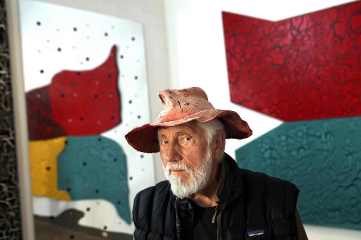 VENICE, CA-MARCH 27, 2015: Artist Ed Moses is photographed in front of acrylic on canvas crackle paintings at his studio in Venice on March 27, 2015. Moses is one of six Los Angeles artists discussing their memories of the Los Angeles County Museum of Art (LACMA) on the eve of its 50th anniversary party. (Mel Melcon/Los Angeles Times)