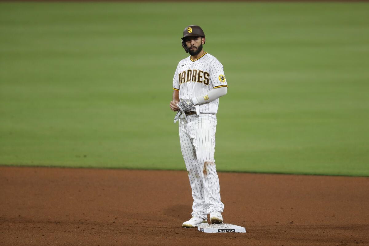 Padres Eric Hosmer stands on second base after his second 3-run double on opening day against the Diamondbacks.